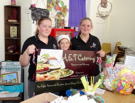 A.E.T. Catering Girls with Banner