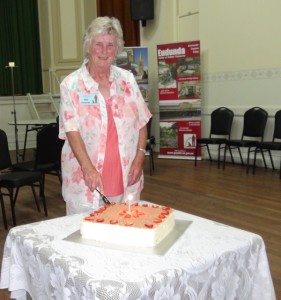 Eudundas Citizen of the Year - Pam Dutschke cutting the Heritage Gallery Birthday Cake - Feb 2017